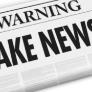 Vector image of newspapers that have big headlines saying: "Warning FAKE NEWS!"